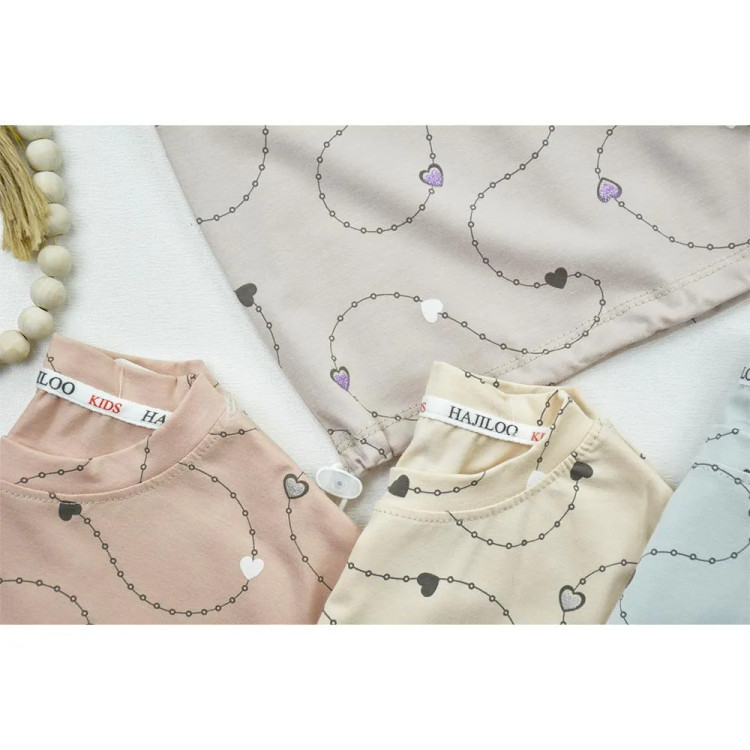 تیشرت باکسی دخترانه طرح ریسه قلبی جنس پنبه ترک با بند تنظیم پایین تیشرت